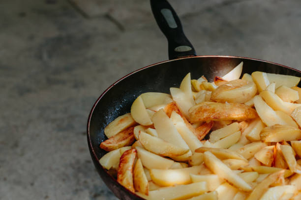 istock Fried potatoes in a frying pan 852902976