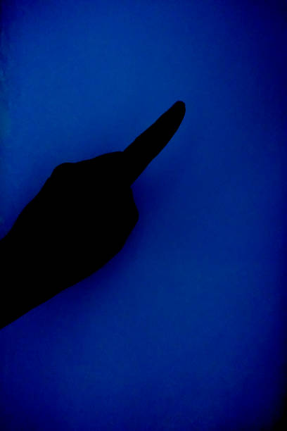 istock Hand showing a finger on a blue background 852915762