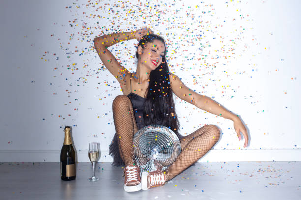 istock Young woman sitting on floor and having fun 852939570