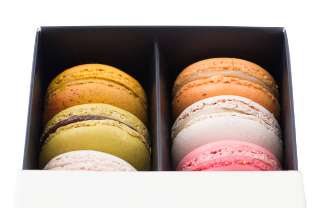 istock Colorful macaroons. Sweet macarons in the box on white background. 852939866