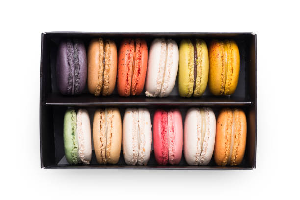 istock Colorful macaroons. Sweet macarons in the box on white background. 852939874