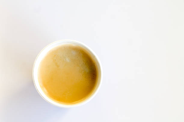 istock Coffee to go with foam in a paper cup on a white background 852945154