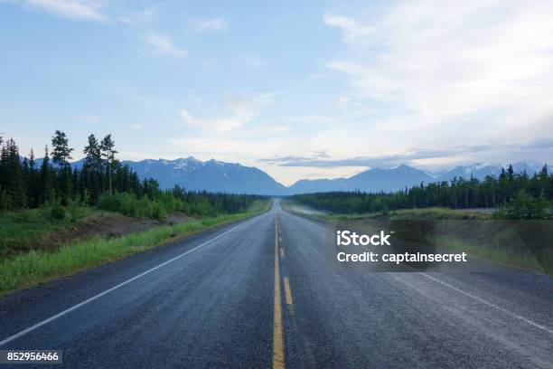 Centre Of A Long Deserted Alaska Highway Stock Photo - Download Image Now - Road, Canada, Long