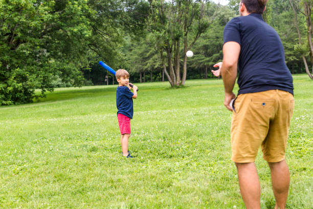 istock Happy father and his son playing baseball 852960016