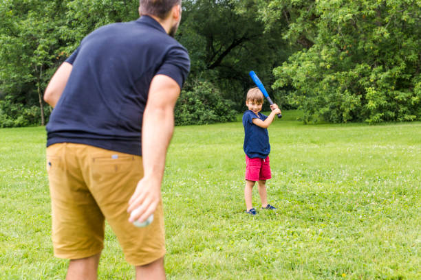 istock Happy father and his son playing baseball 852960118