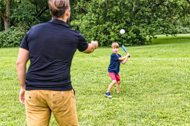 istock Happy father and his son playing baseball 852960490