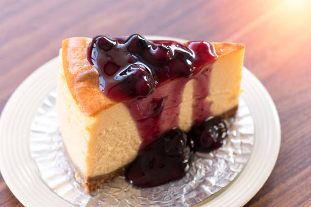 istock Homemade blueberry New York cheesecake on white plate 852960512