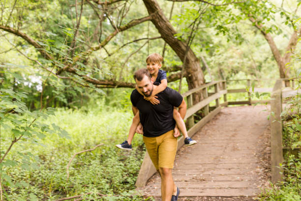 istock Father and son in forest on a meadow 852967802