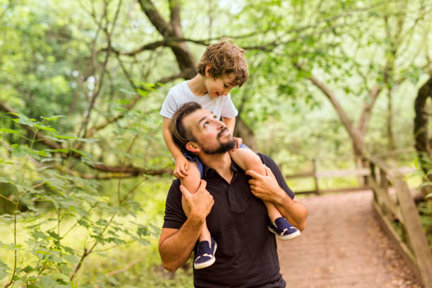 istock Father and son in forest on a meadow 852968028
