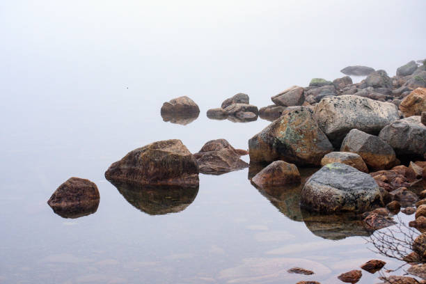 istock Rocky Foggy Lakeside 852981248