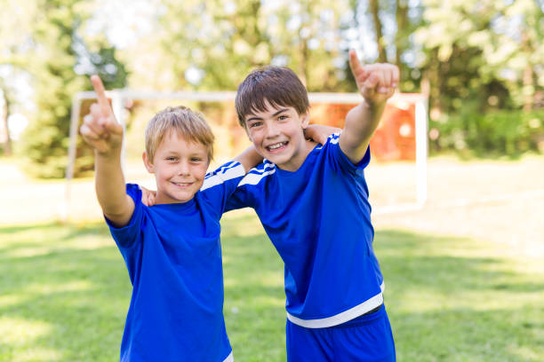 istock Two Young boy with soccer ball on a sport uniform 852988548