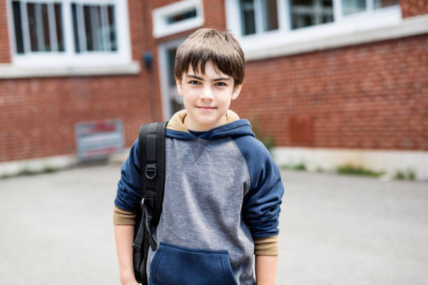 istock Nice Pre-teen boy outside at school having good time 852988866