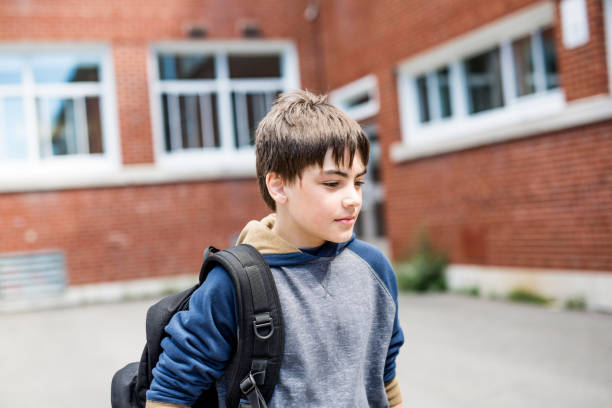 istock Nice Pre-teen boy outside at school having good time 852988926