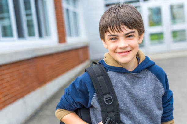 istock Nice Pre-teen boy outside at school having good time 852996498