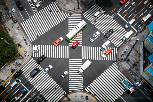 High angle view of land vehicles passing a crossing in Ginza.