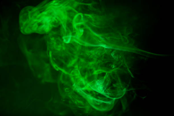 istock Green smoke motion on black background. 853017656