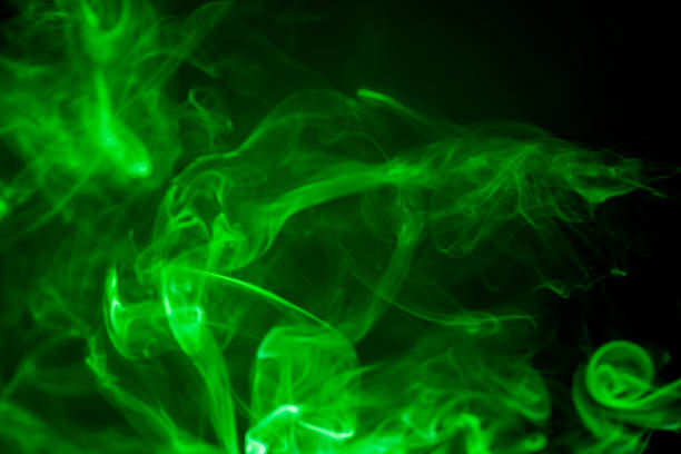 istock Green smoke motion on black background. 853021428