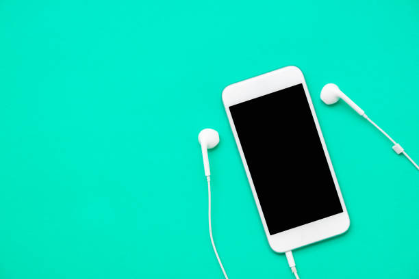 istock Top view of white mobile phone with headphone 853034948