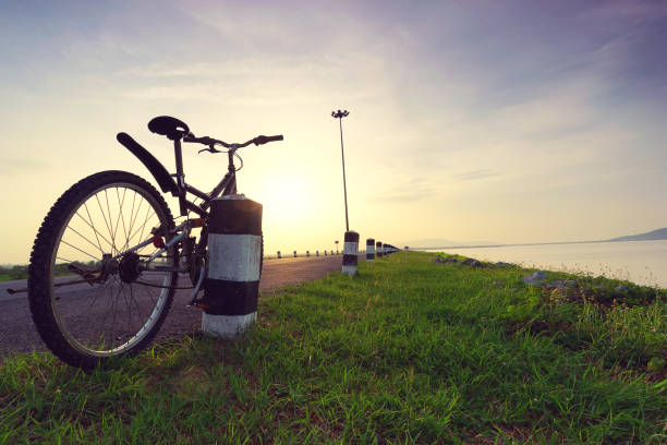 istock Bicycle on the way to landscape view at sunset. 853053774