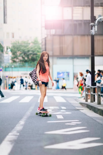 istock Young Woman Riding Skateboard 853054390