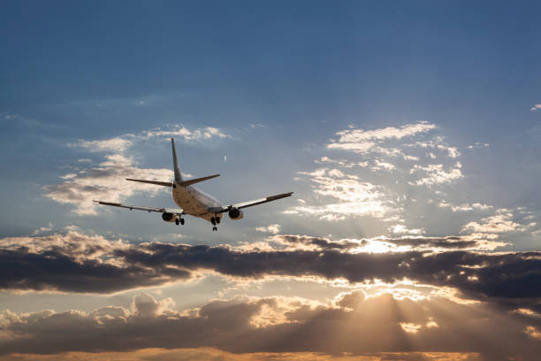 Airplane in the sky and cloud at sunris