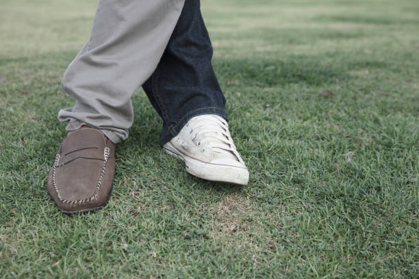 istock Man casual leather brown shoes is standing in a relaxed. 853071306