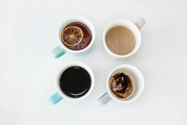 istock Different cups of coffee on white background 853077784