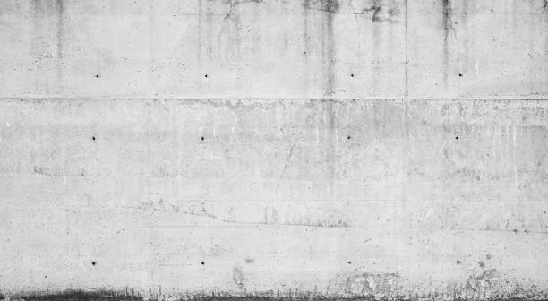 istock Gray concrete wall with dark wet stains 853082808