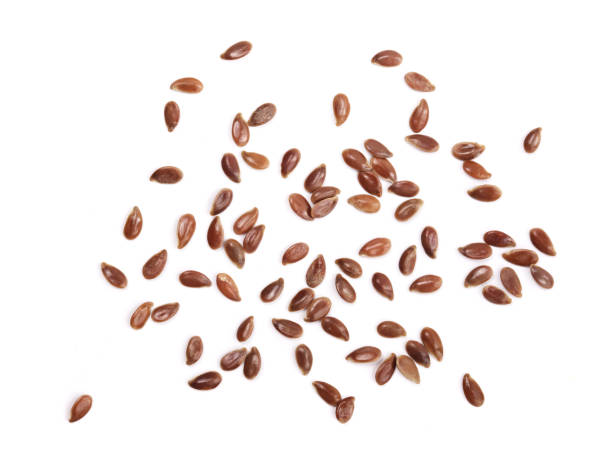 istock flax seeds isolated on white background. Top view 853106398