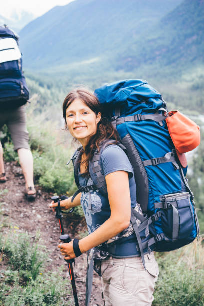istock young woman hiking 853111512