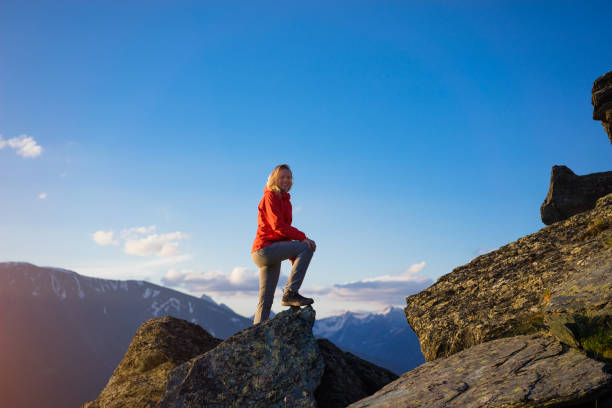 istock young woman hiking 853114560