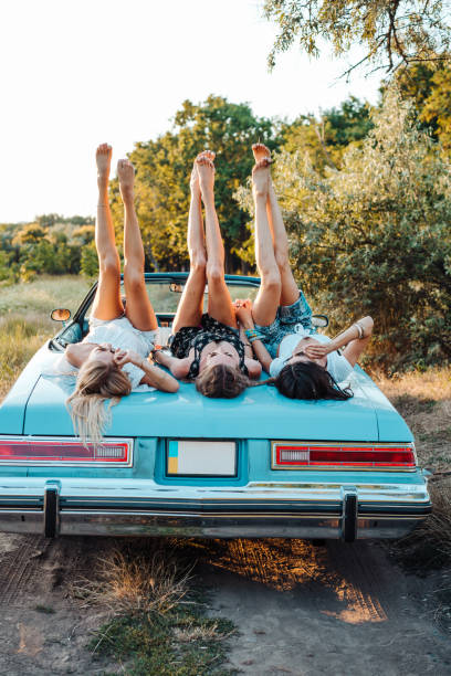 istock Three girls are lying on the trunk 853119788