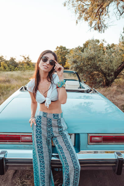 istock Girl posing on a background cabriolet 853124758