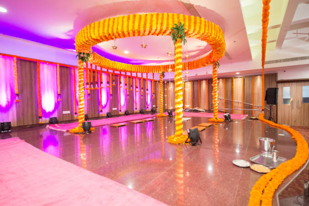 Wedding Hall decorated with flowers Wedding Hall decorated with flowers - Indian Hindu Wedding wedding hall stock pictures, royalty-free photos & images