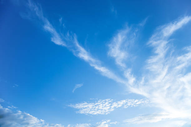 istock White fluffy clouds in the blue sky 853126124
