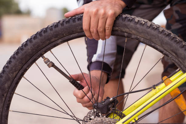 Bike tire shredded with hand pump in background