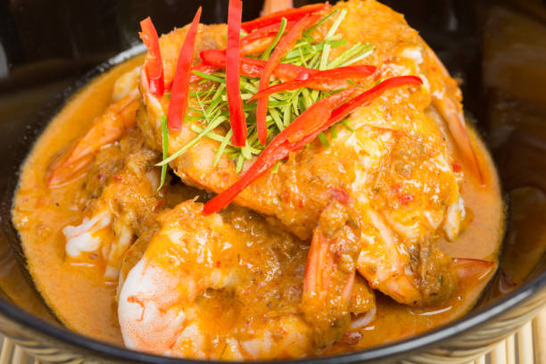 istock Curry fried shrimps in black cup closeup 853146222