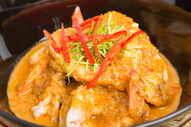 istock Curry fried shrimps in black cup closeup 853146318