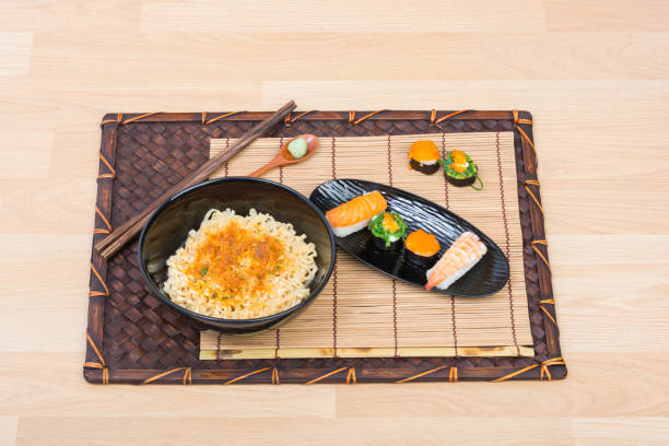 istock sushi and noodle in black dish 853146734