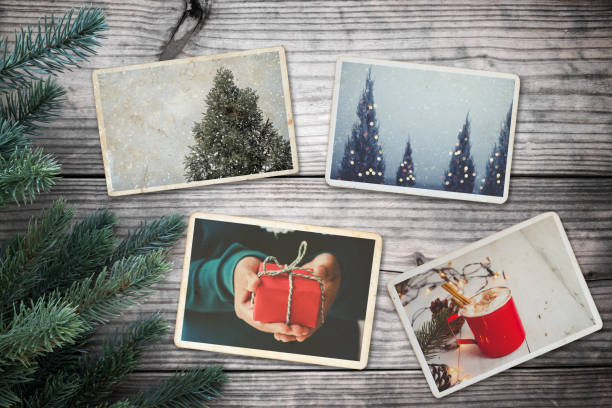 remembrance and nostalgia in Christmas Photo album in remembrance and nostalgia in Christmas (winter season) on wood table. photo of retro camera - vintage and retro style, topview christmas tree photos stock pictures, royalty-free photos & images