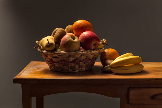 istock basket of fruit on a wooden table 853156192