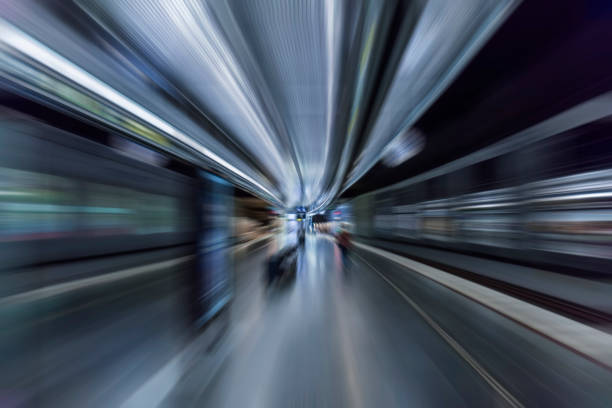 istock subway train passing through station, passengers waiting on the platform 853156210