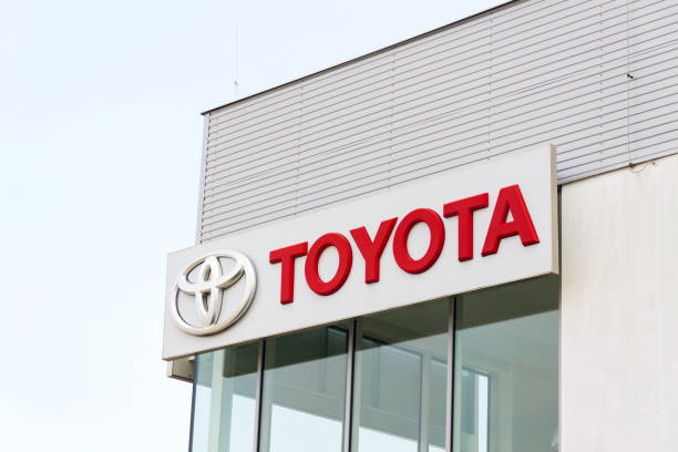 Toyota motor corporation logo on dealership building Prague, Czech republic - September 23, 2017: Toyota motor corporation logo on dealership building on September 23, 2017 in Prague. Toyota turns its Gazoo Racing Team into new sports brand, the GR brand. bohemia czech republic photos stock pictures, royalty-free photos & images