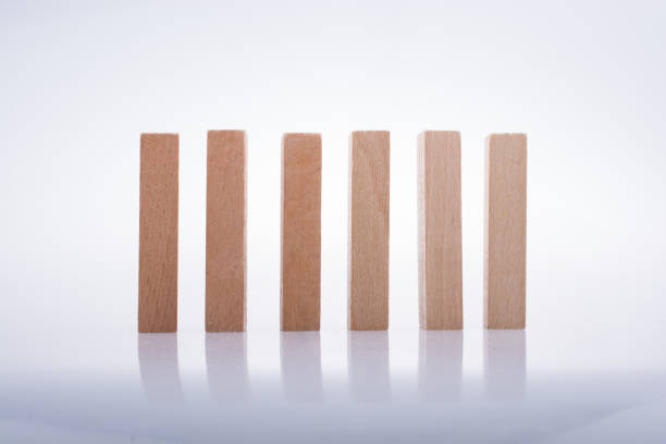 istock Wooden domino blocks on white background 853169506