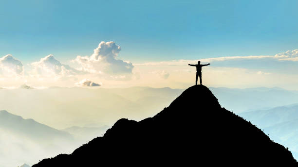 businessman success raising arms stand on top of hill - thailand asia famous place stone imagens e fotografias de stock