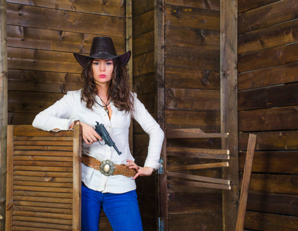 istock girl with gun cowboy 853170850