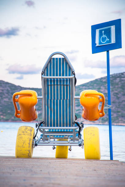istock Beach wheel chair for disabled swimmers, Elounda, Crete, Greece 853189406