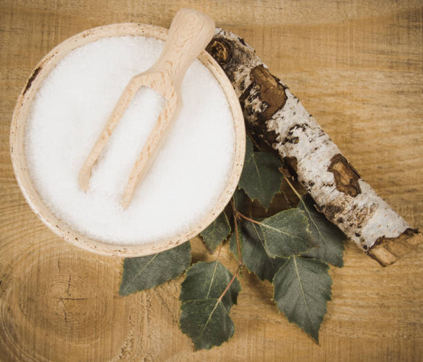 istock Xylitol - sugar substitute. Birch sugar on wooden background. 853189712