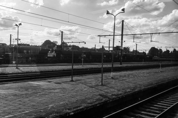 istock black and white industrial train tracks and cooling tower 853210922