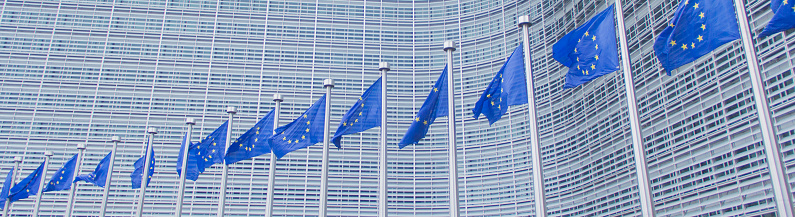 The flags of the European Union at the European Commission's headquarter, the so-called Berlaymont Building in Brussels, Belgium.